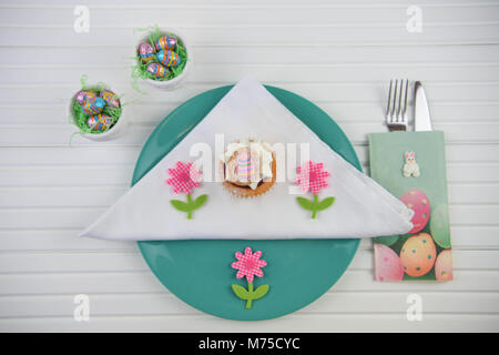 colorful Easter table place setting on white Stock Photo