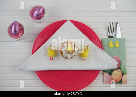 colorful Easter table place setting on white Stock Photo