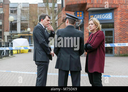 Home Secretary Amber Rudd (right) with Wiltshire Police Assistant Chief Constable Kier Pritchard (centre) and MP for Salisbury and South Wiltshire John Glen (left) visit the scene at the Maltings shopping centre in Salisbury where former Russian double agent Sergei Skripal and his daughter were found critically ill after exposure to a nerve agent. Stock Photo