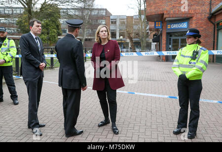 Home Secretary Amber Rudd (centre right) with Wiltshire Police Assistant Chief Constable Kier Pritchard (centre) and MP for Salisbury and South Wiltshire John Glen (centre left) visit the scene at the Maltings shopping centre in Salisbury where former Russian double agent Sergei Skripal and his daughter were found critically ill after exposure to a nerve agent. Stock Photo