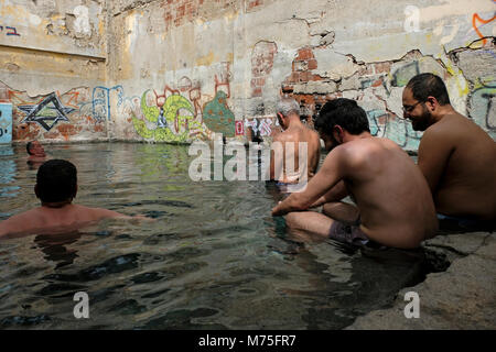 Israeli Arab bath in a hot spring water pool named by locals Ein Jones near Hamat Gader, at the southern tip of the Israeli-occupied Golan Heights near the border with Jordan Stock Photo