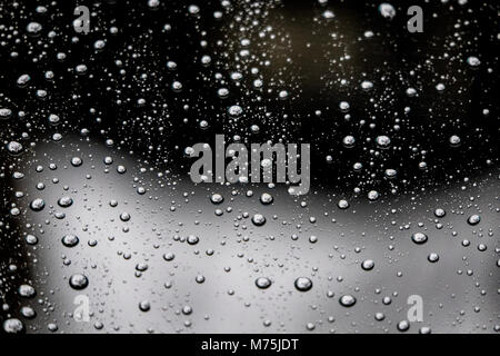 Raindrops Beaded on glass Forming an abstract pattern Stock Photo