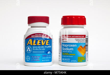 Brand name Bayer Aleve and CVS store brand generic Naproxen Sodium Bottles. Stock Photo