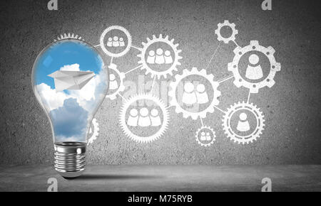 Lightbulb with flying paper plane and clouds inside placed against sketched social gear structure on wall. 3D rendering. Stock Photo