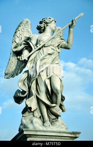 Marble statue of angel holding the Holy Lance of Longinus. Sant'Angelo bridge balustrade. Rome, Italy Stock Photo