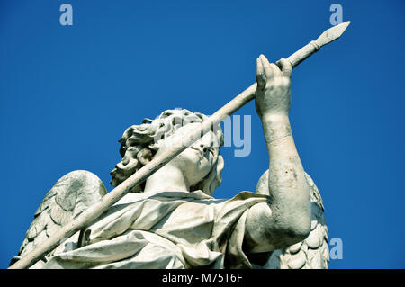 Marble statue of angel holding the Holy Lance of Longinus. Sant'Angelo bridge balustrade. Rome, Italy Stock Photo