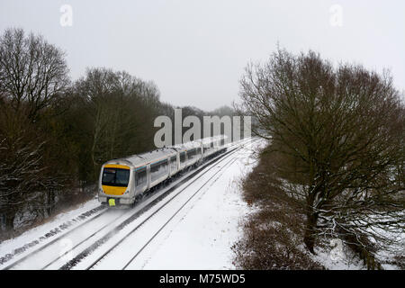A Chiltern Railways class 168 Mainline train in snowy conditions, Warwickshire, UK Stock Photo