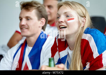 British football fans watching match at home Stock Photo