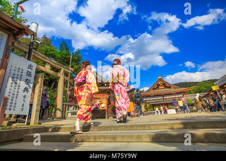 Kyoto, Japan - April 24, 2017: Japanese women in kimono visit Yasaka Shrine in spring season. Gion Shrine is one of the most famous shrines in Kyoto between Gion District and Higashiyama District. Stock Photo