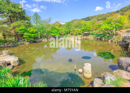 Beautiful landscape of pond in Maruyama Park, spring season with blue sky in Higashiyama District, Kyoto, Japan. Maruyama Park is Kyoto's most famous cherry-blossom viewing hanami spot. Stock Photo