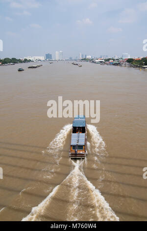 Boat trafic at the chao phraya river in the city of Bangkok in Thailand ...
