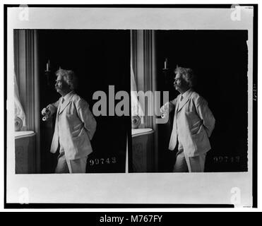 Mark Twain (Samuel Langhorne Clemens), three-quarter length portrait, standing by window, facing left LCCN00652751 Stock Photo
