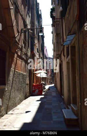 Red House with shuttered windows and Romeo & Juliet Balconies in Venice Italy Stock Photo