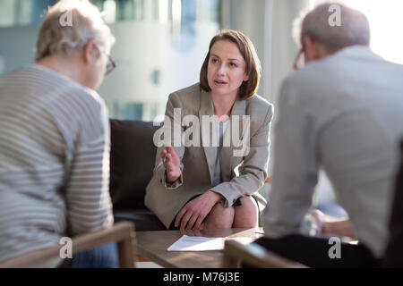 Senior couple with financial advisor Stock Photo