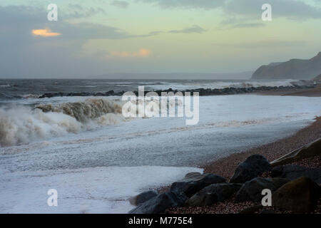 Wsst Bay beach on a stormy day in winter with huge breaking waves crashing on the beach. Stock Photo