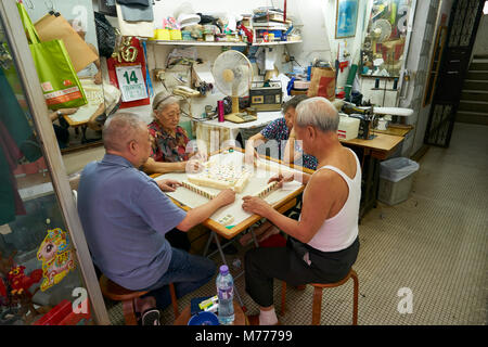 Elderly couples playing Mahjong, Hong Kong, China, Asia Stock Photo