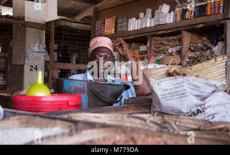 A man wearing a traditional kofia in the market in Pangani, Tanzania, East Africa, Africa Stock Photo