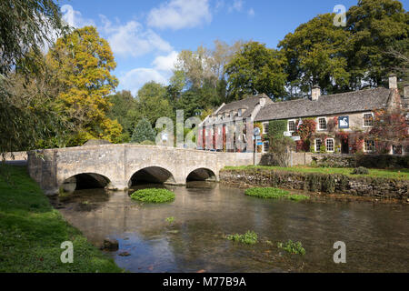 River Coln and The Swan Hotel in autumn, Bibury, Cotswolds, Gloucestershire, England, United Kingdom, Europe