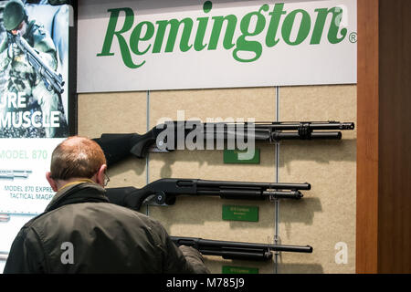 09 March 2018, Germany, Nuremberg: Rifles by the American manufacturer Remington are displayed at the company's stand at the IWA OutdoorClassics trade show for hunting, shooting sports, equipment for outdoor activities and for civilian and official security applications. Photo: Daniel Karmann/dpa Stock Photo