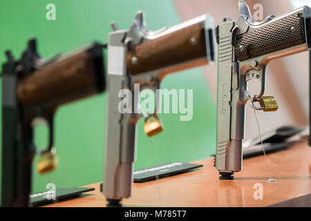 09 March 2018, Germany, Nuremberg: Handguns by the American manufacturer Remington are displayed at the company's stand at the IWA OutdoorClassics trade show for hunting, shooting sports, equipment for outdoor activities and for civilian and official security applications. Photo: Daniel Karmann/dpa Stock Photo