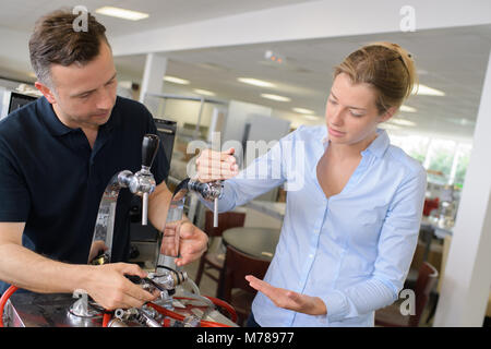 scientist fixing machine Stock Photo