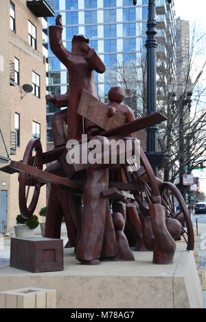 A sculpture marks the labor speakers spot in Chicago's Haymarket Square. A bomb thrown at police during the demonstration starting a riot May 4, 1886. Stock Photo