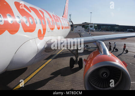 EasyJet plane waiting for passengers to board, Luton Airport, UK