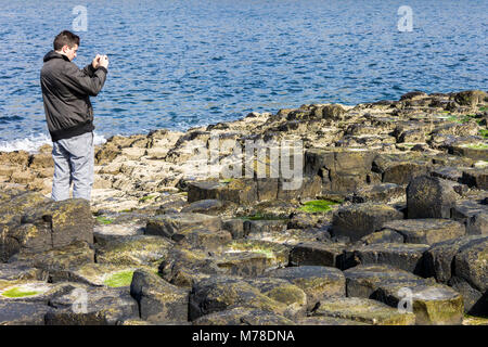 The Giant's Causeway, basalt columns from an ancient volcanic eruption in County Antrim on the north coast of Northern Ireland, close to the town of B Stock Photo