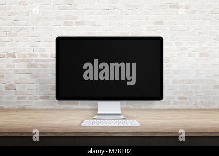 Clean workplace with computer display. Blank screen for web site promotion. Empty desk and brick wall. Stock Photo