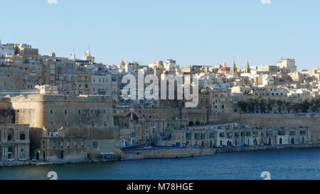 Central Valletta as seen from Senglea Peninsula. Buildings crammed together and ramparts to protect from invasion Stock Photo