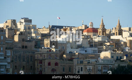 Central Valletta as seen from Senglea Peninsula. Buildings crammed together and ramparts to protect from invasion Stock Photo