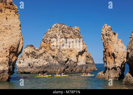 Kayaker exploring Ponta da Piedade Cape, near Lagos, Algarve, Portugal, Europe Stock Photo