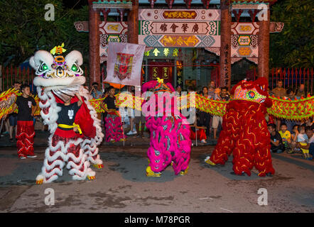 Participants in a Lion dance during the Mid autumn festiaval in Hoi An ,Vietnam Stock Photo