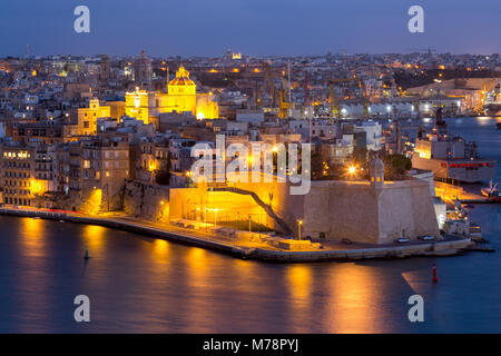 Night view of Senglea, one of the Three Cities, and the Grand Harbour in Vallettaan Capital of Culture 2018, Valletta, Malta, Mediterranean Stock Photo