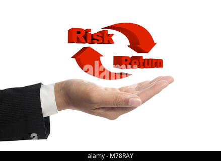 Risk and return symbol on hands. Stock Photo