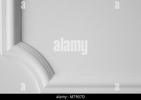 Decorative item made of white plaster on ceiling. Relief stucco interior Stock Photo