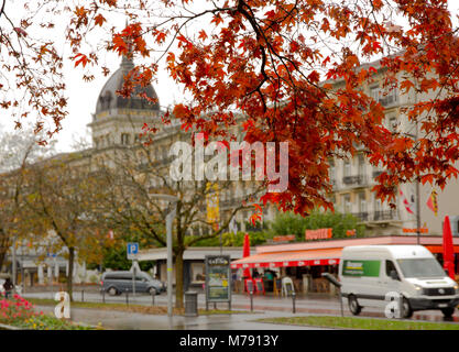 Interlaken, Switzerland  - Oct 26, 2016:  Red maple tree in front of the hotel Stock Photo