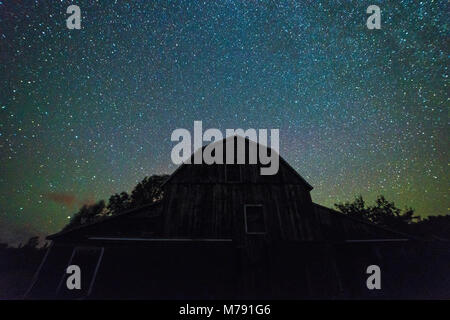 Old Barns and outbuildings with starry sky with clouds and milky way in ...