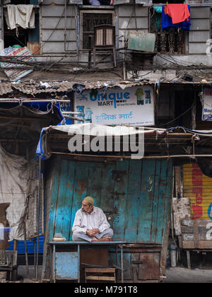 Mumbai, India – November 18, 2018: Muslim shopkeeper at a Market stall in Bhendi Bazaar, Mumbai, India Stock Photo