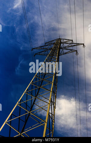 A High voltage pole with blue white sky Stock Photo - Alamy