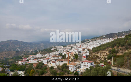 The traditional Spanish Mountain Village of Sayalonga in Andalucia with its many Villas and Houses seemingly tumbling down the Hills. Stock Photo