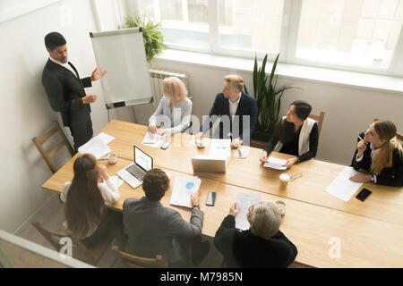 African american ceo giving presentation at corporate team meeti Stock Photo