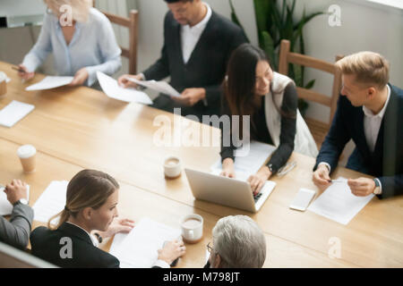 Diverse multiracial business people preparing for group meeting  Stock Photo