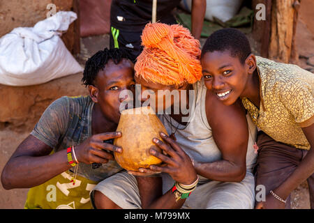 People Drinking Local Beer At The Saturday Tribal Market In Dimeka, Omo Valley, Ethiopia Stock Photo