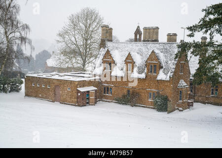 Great Tew Primary School  building in the winter snow. Great Tew, Cotswolds, Oxfordshire, England Stock Photo