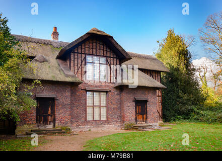 Thatched Queen Charlotte's Cottage at Kew Gardens  botanical garden in southwest London, UK, UNESCO World Heritage Site Stock Photo