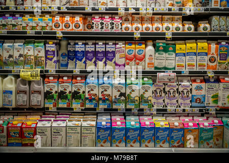 Containers of milk in a supermarket refrigerator in New York Stock Photo -  Alamy