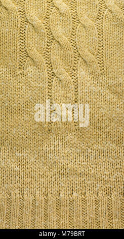 Knit Texture of Beige Wool Knitted Sweater with Cable Knits Pattern. Stock Photo