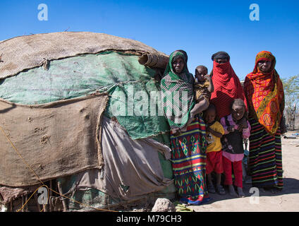 Several generations of afar tribe women in front of their hut, Afar region, Semera, Ethiopia Stock Photo