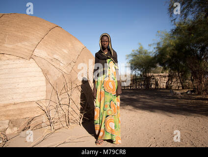 Portrait of an afar tribe teenage girl in front of her hut, Afar region, Afambo, Ethiopia Stock Photo